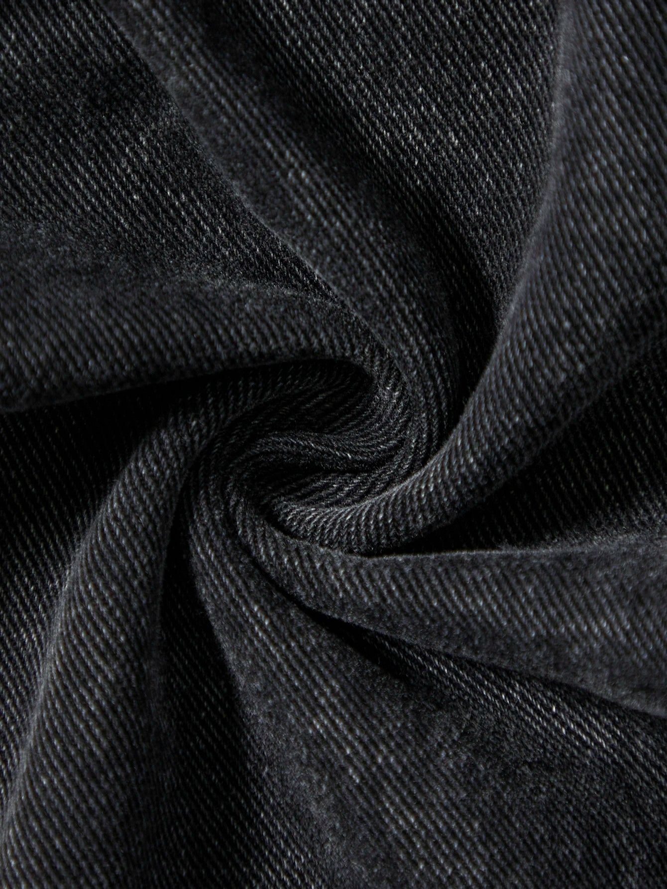 Men's black jeans. With a design of (ripped holes) and tassels. In a street trend style.