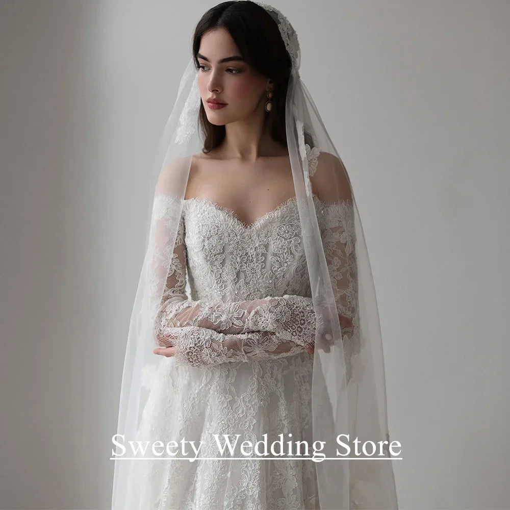 Saudi Arabia Wedding Dress Customized Sweetheart Full Sleeves Pearls Lace Bridal Gown Sweep Train Arabian Bride Dresses