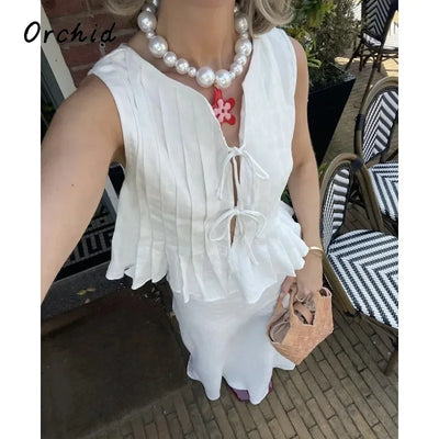 Fashion Bow Lace Up Shirts Women Cotton Linen Hollow Out Sleeveless Pleated Blouses Woman 2025 Summer New Casual Lady White Tops